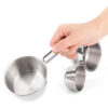 set tazas de medida acero inoxidable 4 piezas en mano