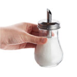 dispensador-para-azucar-vidrio-acero-inoxidable-en-mano.jpg